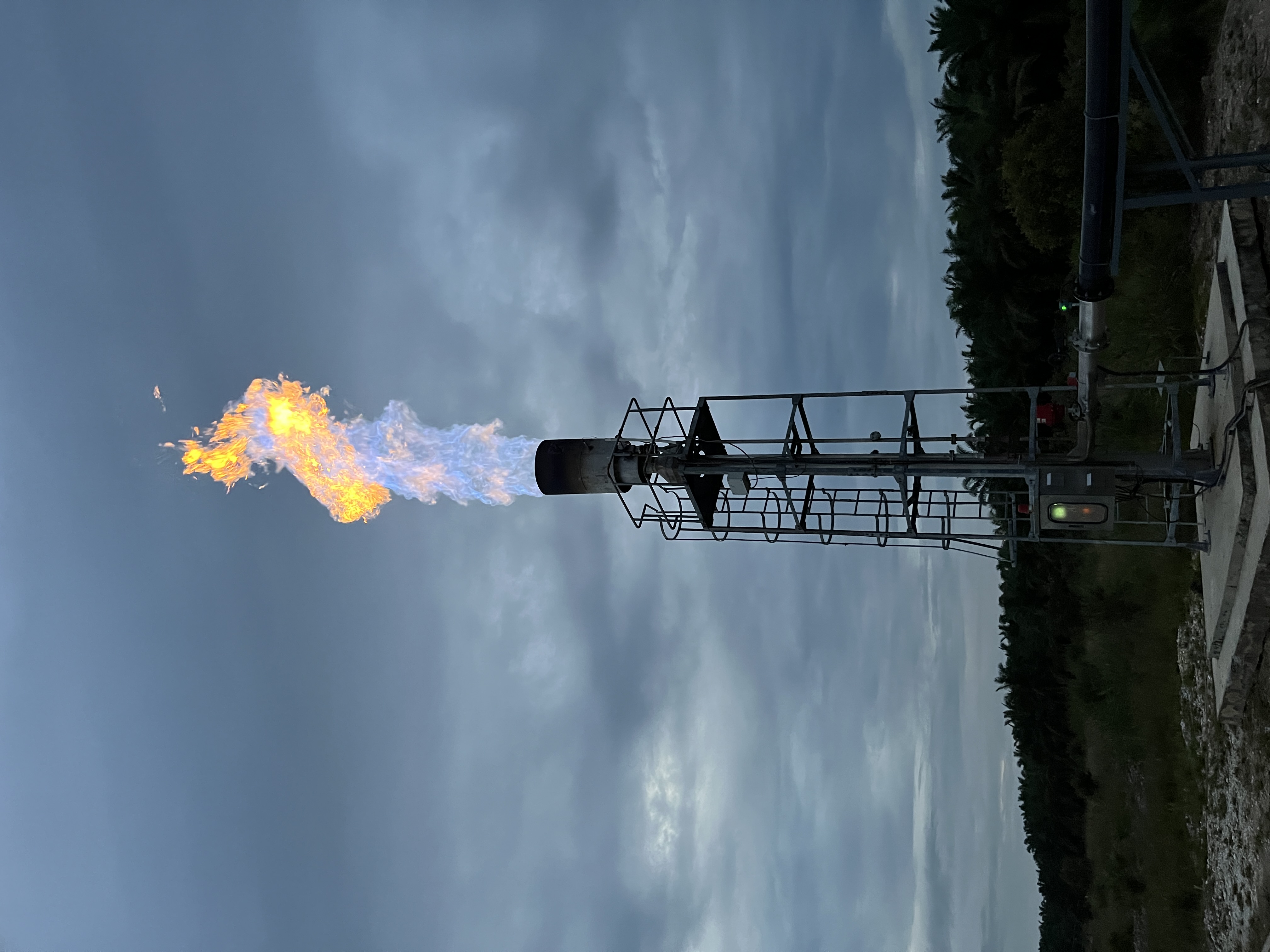 THAGO flare stack in operation at dusk